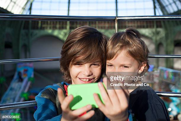 Children taking selfie with smartphone