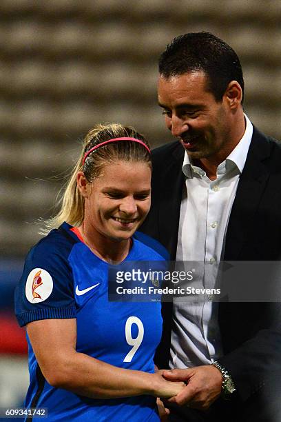 The new France's head coach Olivier Echouafni reacts with Eugenie Le Sommer during the UEFA Women's Euro 2017 qualifying match between France and...
