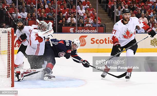 Justin Abdelkader of Team USA collides with Carey Price of Team Canada during the World Cup of Hockey 2016 at Air Canada Centre on September 20, 2016...