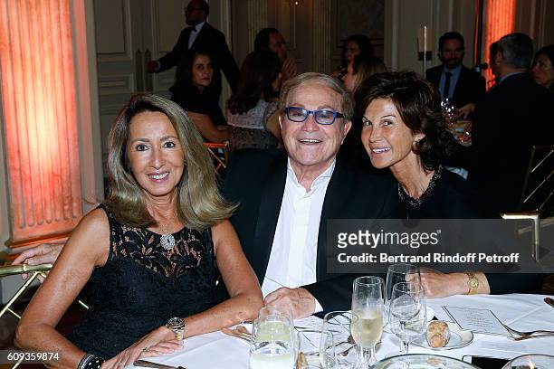 Nicole Coullier, Orlando and Sylvie Rousseau attend the Charity Dinner to Benefit 'Claude Pompidou Foundation' following the "Cezanne et Moi" movie...