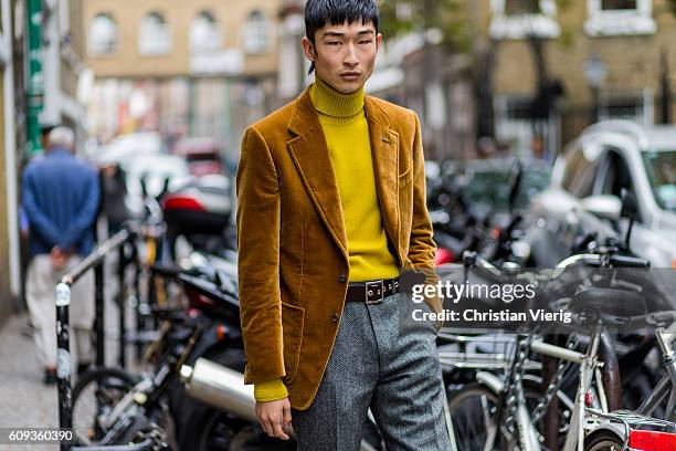 Model Sang Woo Kim outside Marques Almeida during London Fashion Week Spring/Summer collections 2017 on September 20, 2016 in London, United Kingdom.