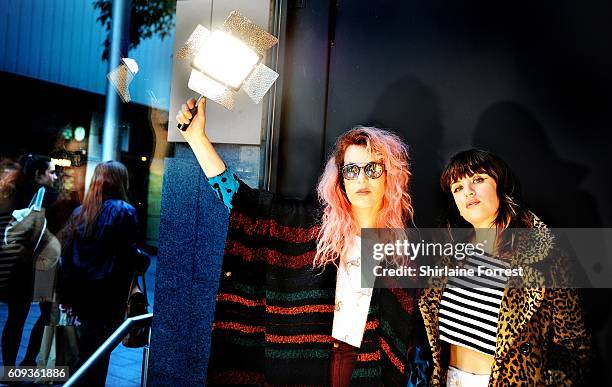 Lindsey Troy and Julie Edwards of Deap Vally pose in the shop window after performing live and signing copies of their new album 'Femejism' at HMV...