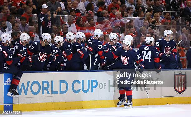 Ryan McDonagh of Team USA high fives the bench after scoring a first period goal on Team Canada during the World Cup of Hockey 2016 at Air Canada...