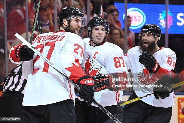 Alex Pietrangelo, Sidney Crosby and Brent Burns of Team Canada celebrate after a second period goal on Team USA during the World Cup of Hockey 2016...