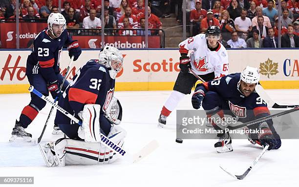 Jonathan Quick makes a save with Dustin Byfuglien of Team USA diving in front during the World Cup of Hockey 2016 at Air Canada Centre on September...