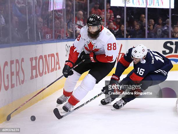 Brent Burns of Team Canada stickhandles the puck with James Van Riemsdyk of Team USA chasing during the World Cup of Hockey 2016 at Air Canada Centre...