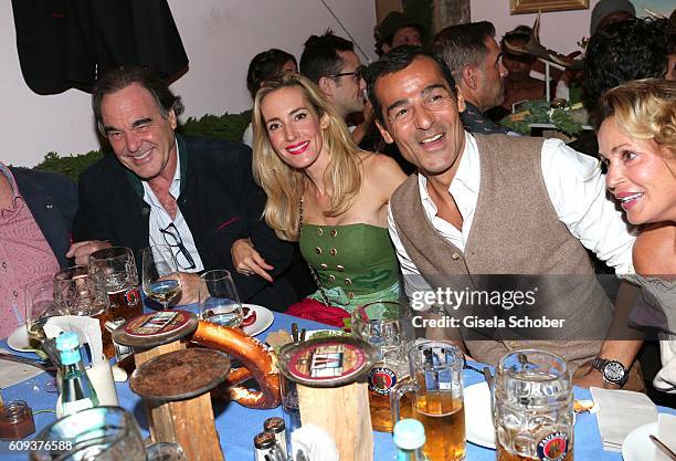 Director Oliver Stone, his nice Caroline Goddet and her husband Erol Sander during the Oktoberfest at Kaeferschaenke at Theresienwiese on September...