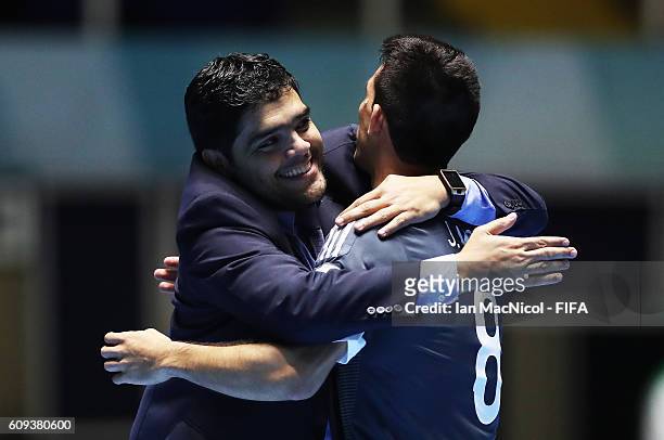 Carlos Chilavert the coach of Paraguayy celebrates with Juan Morel of Paraguay as Paraguay win a penalty shoot out during the FIFA Futsal World Cup...