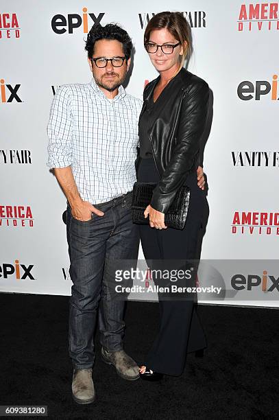 Director and host committee member J.J. Abrams and host committee member Katie McGrath attend the Premiere of Epix's "America Divided" at Billy...