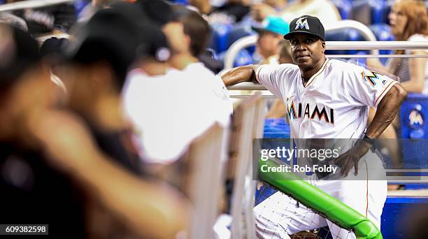 Hitting coach Barry Bonds of the Miami Marlins looks on from the dugout during the game against the Washington Nationals at Marlins Park on September...