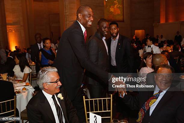 President of Africa and Latin America Exploration & Production Company at Chevron Corporation Ali Moshiri, professional basketball player Dikembe...