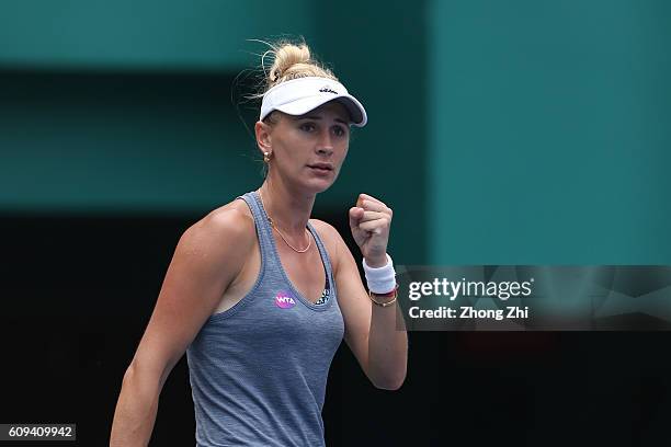 Olga Govortsova of Belarus celebrates a point during the match against Elizaveta Kulichkova of Russia on Day 2 of WTA Guangzhou Open on September 20,...