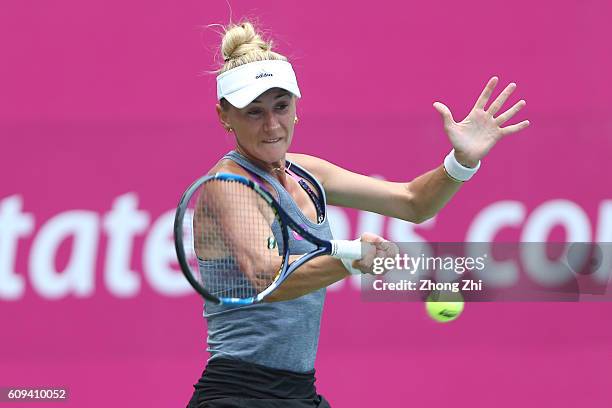 Olga Govortsova of Belarus returns a shot during the match against Elizaveta Kulichkova of Russia on Day 2 of WTA Guangzhou Open on September 20,...