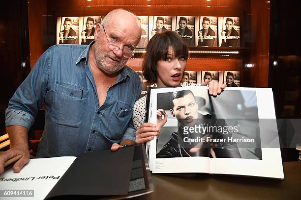 Photographer Peter Lindbergh and actress Milla Jovovich attend photographer Peter Lindbergh Book Signing for "A Different Vision On Fashion...