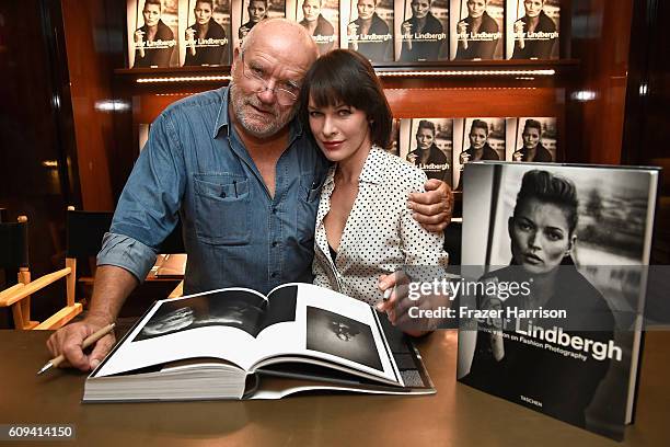 Photographer Peter Lindbergh and actress Milla Jovovich attend photographer Peter Lindbergh Book Signing for "A Different Vision On Fashion...