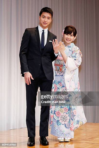 Hung-Chieh Chiang of Chinese Taipei and Ai Fukuhara of Japan pose for photographs during press conference on September 21, 2016 in Tokyo, Japan....