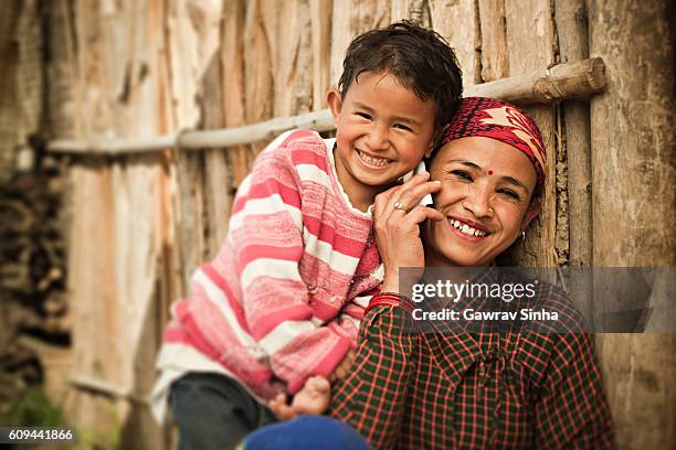 happy asian mother and daughter on the phone. - rural indian family stock pictures, royalty-free photos & images