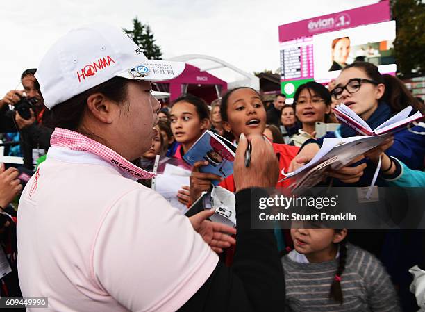 Shanshan Feng of China signs autographs for fans after the third round of The Evian Championship on September 17, 2016 in Evian-les-Bains, France.