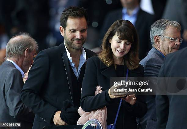 Christophe Michalak and his wife Delphine McCarty attend the French Ligue 1 football match between Paris Saint-Germain and Dijon FCO at Parc des...