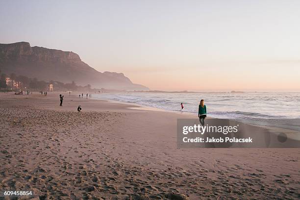 camps bay beach at dusk - camps bay stock pictures, royalty-free photos & images