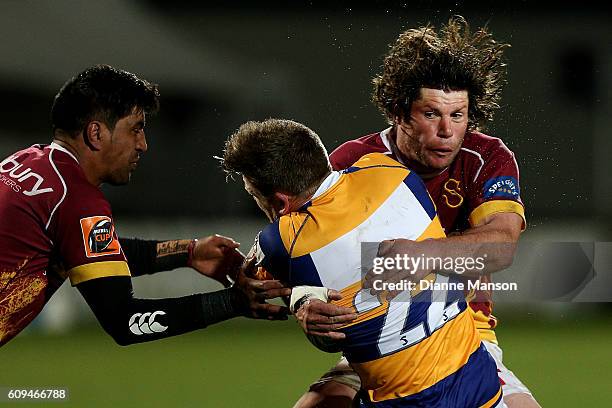 Nick Evemy of Bay of Plenty in the tackle of Tim Boys and Dyland Collier of Southland during the Mitre 10 Cup round 6 match between Southland and Bay...