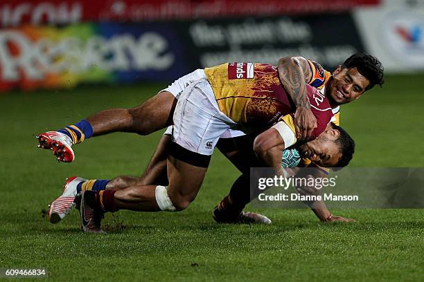 Junior Ngaluafe of Southland tries to break the tackle of Regan Ware of Bay of Plenty during the Mitre 10 Cup round 6 match between Southland and Bay...