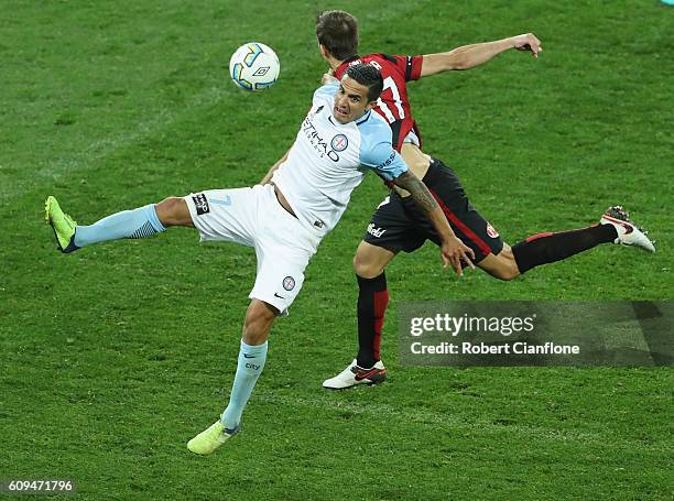 Tim Cahill of Melbourne City challenges Artiz Borda of the Wanderers during the FFA Cup Quarter Final between Melbourne City and Western Sydney at...