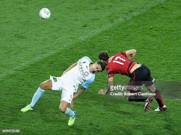 Tim Cahill of Melbourne City challenges Artiz Borda of the Wanderers during the FFA Cup Quarter Final between Melbourne City and Western Sydney at...
