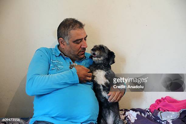 Delivery man Murat Ozgen, is seen with his dog "zeytin" in Istanbul, Turkey on September 10, 2016. Ozgen goes to work with his dog everyday, as...