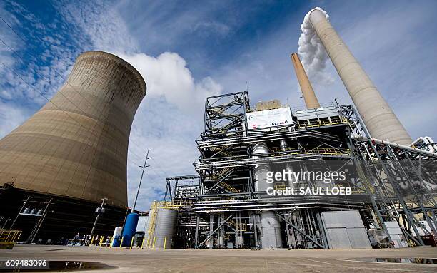 American Electric Power's Mountaineer coal power plant, with new carbon capture unit , alongside the plant's cooling tower and stacks, in New Haven,...