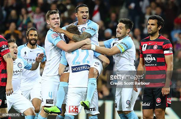 Michael Jakobsen of City is congratulated by Tim Cahill, Bruno Fornaroli and his teammates after scoring their first goal during the FFA Cup Quarter...