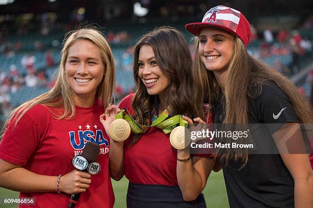 Fox Sports West reporter poses with Courtney Mathewson, left, and Maddie Musselman, right, of the United States women's water polo team and their Rio...