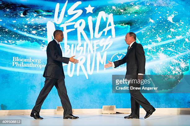 President Barack Obama shakes hands with former New York City mayor Michael Bloomberg before speaking at the U.S.-Africa Business Forum at the Plaza...
