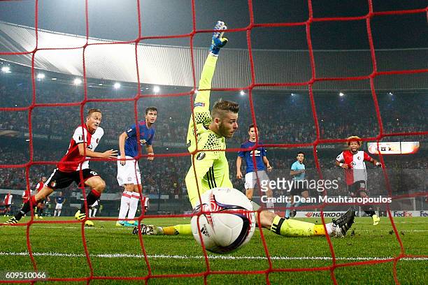 Tonny Vilhena of Feyenoord scores his sides first goal past goalkeeper David De Gea of Manchester United during the UEFA Europa League Group A match...