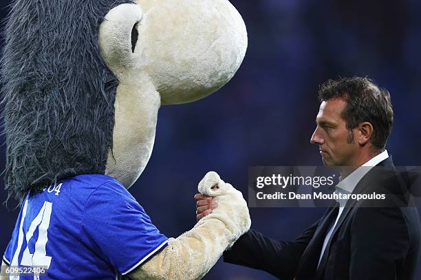 Schalke Manager / Head Coach, Markus Weinzierl shakes hands with Erwin the mascot of Schalke prior to the Bundesliga match between FC Schalke 04 and...