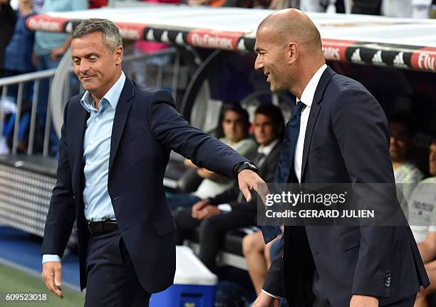 Real Madrid's French coach Zinedine Zidane greets Villarreal's coach Fran Escriba before the Spanish league football match Real Madrid CF vs...