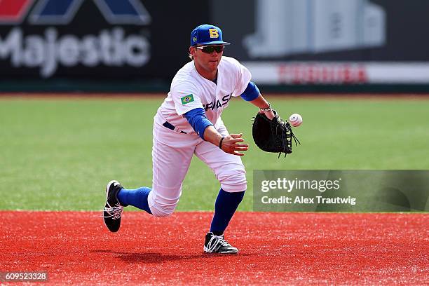 Dante Bichette Jr. #19 of Team Brazil fields a ball during workouts at MCU Park prior to the start of the 2016 World Baseball Classic Qualifier on...