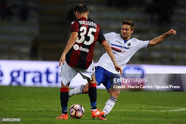 Vasilis Torosidis of Bologna FC competes the ball with Karol Linetty of UC Sampdoria during the Serie A match between Bologna FC and UC Sampdoria at...