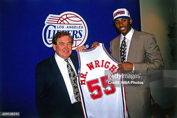 Lorenzen Wright of the Los Angeles Clippers poses with Head Coach Bill Fitch in this circa 1996 photo at the Los Angeles Memorial Sports Arena in Los...