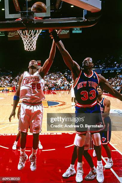 Lorenzen Wright of the Los Angeles Clippers defends against Patrick Ewing of the New York Knicks on November 8, 1996 at the Los Angeles Memorial...