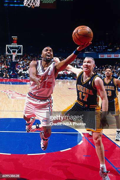 Brent Barry of the Los Angeles Clippers goes to the basket against Chris Mullin of the Indiana Pacers in Circa 1998 at the Los Angeles Memorial...