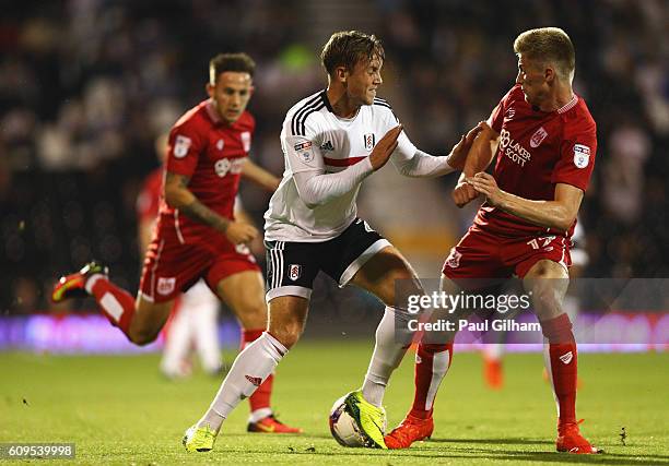 Lasse Vigen Christensen of Fulham battles with Taylor Moore of Bristol City during the EFL Cup Third Round match between Fulham and Bristol City at...