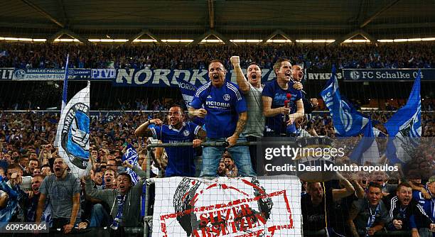 Fans celebrate after Klaas-Jan Huntelaar of Schalke scores his teams first goal of the game during the Bundesliga match between FC Schalke 04 and 1....