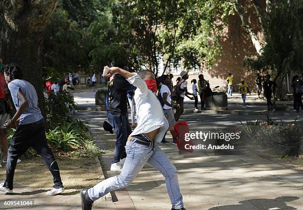 Group of students clash with security forces as they gather to protest after South African Minister of Higher Education and Training Blade Nzimande's...