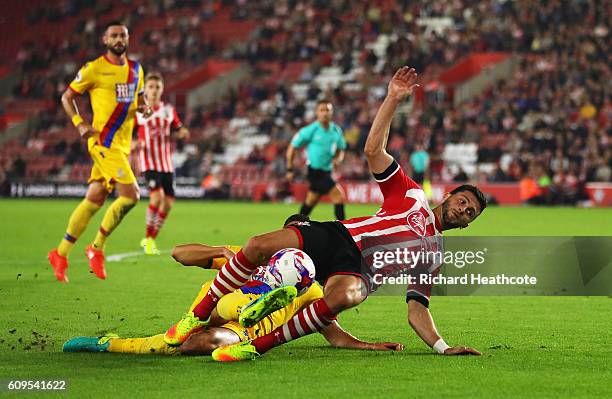 Shane Long of Southampton is fouled by Martin kelly of Crystal Palace inside the penalty area during the EFL Cup Third Round match between...