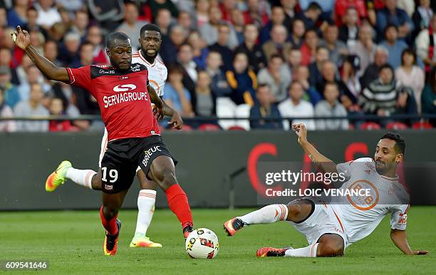 Guingamp's French midfielder Yannis Salibur vies with Lorient's French Algerian midfielder Walid Mesloub during the French L1 football match Guingamp...