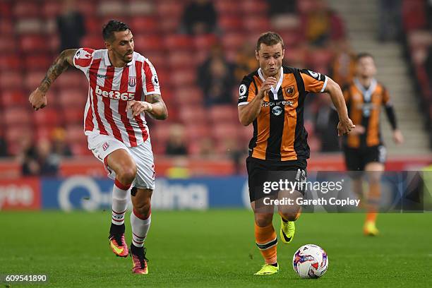 Shaun Maloney of Hull City and Geoff Cameron of Stoke City in action during the EFL Cup Third Round match between Stoke City and Hull City at the...