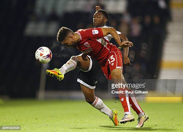 Adetayo Edun of Fulham and Scott Golbourne of Bristol City in action during the EFL Cup Third Round match between Fulham and Bristol City at Craven...