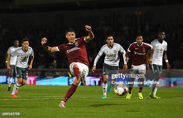 Alex Revell of Northampton Town scores his sides first goal during the EFL Cup Third Round match between Northampton Town and Manchester United at...