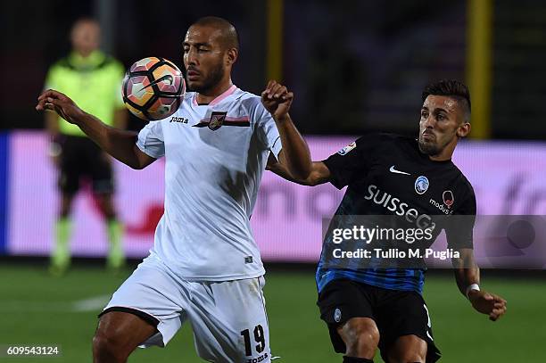 Haitam Aleesami of Palermo and Marco D'Alessandro of Atalanta compete for the ball during the Serie A match between Atalanta BC and US Citta di...